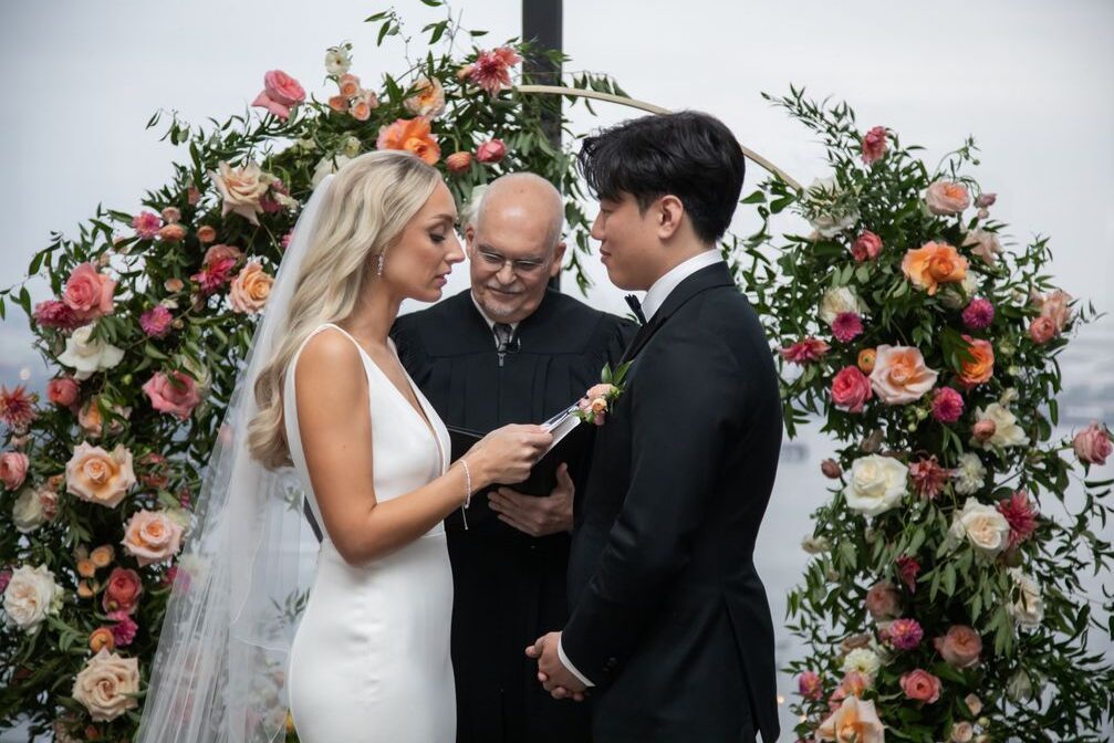bride and groom exchanging vows during their wedding at the State Room in Boston