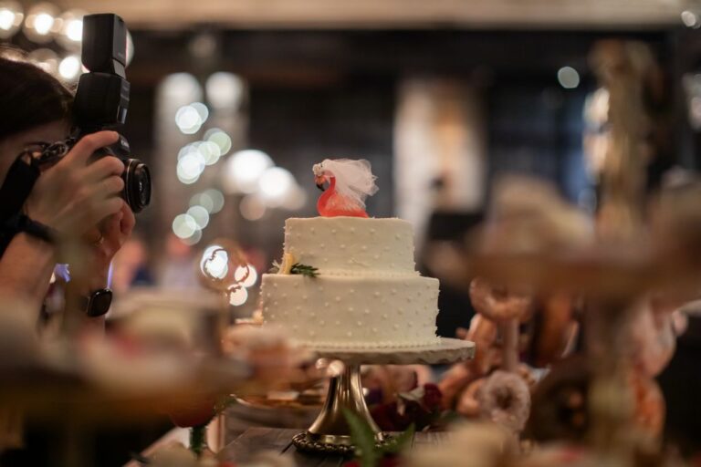 Nanore of Spagnolo Photography is seen photographing a wedding cake at the Ledger Restaurant in Salem, MA.