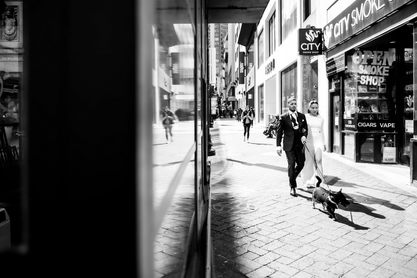 Bride and groom walking through Boston on their way to get married at Boston City Hall