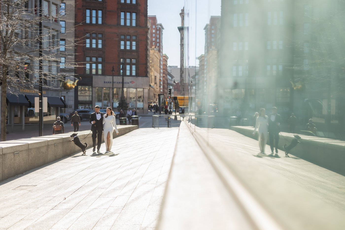 Bride and groom walking through Boston on their way to get married at Boston City Hall