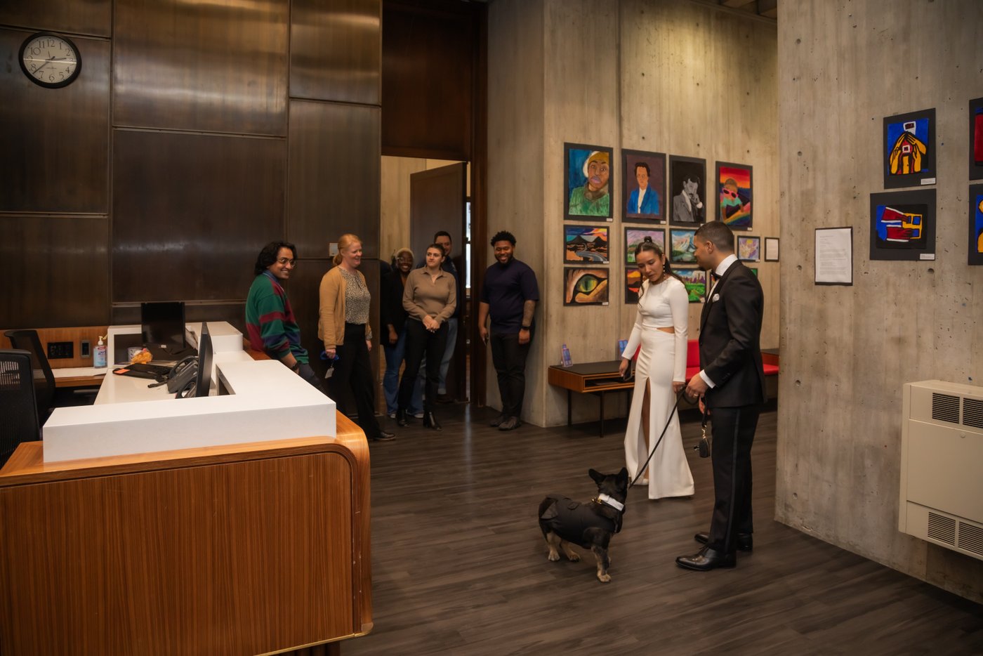 Boston City Hall staff greeting the newlyweds and their dog