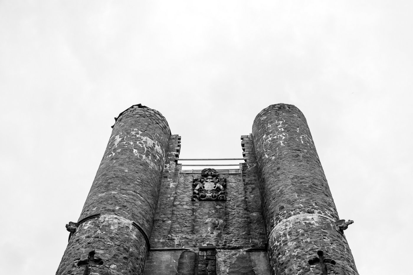A black and white architectural photograph of the Hammond Castle towers on a wedding day.