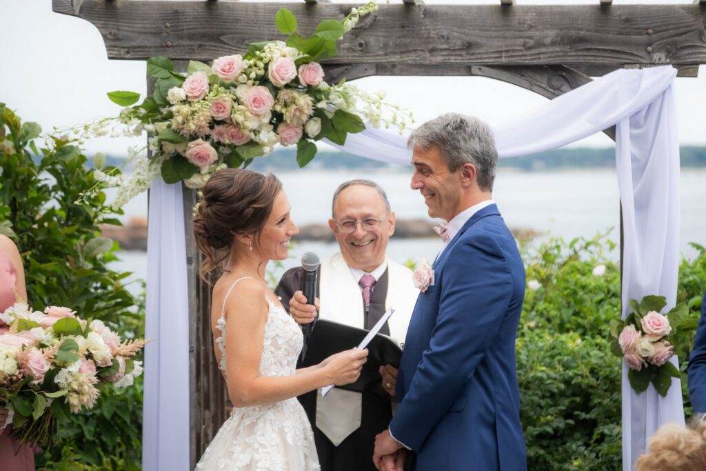 The bride smiles during her vows