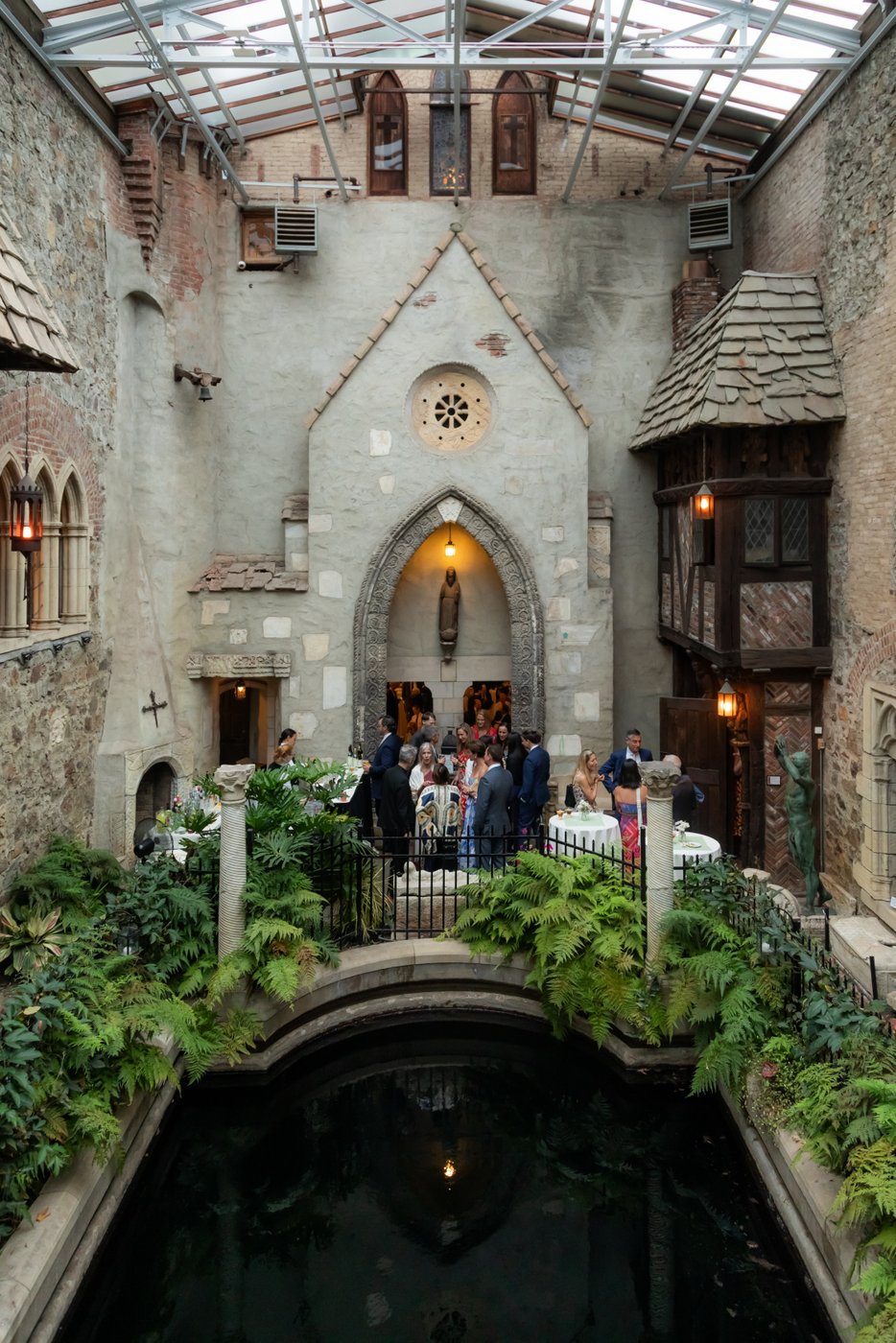 The Hammond Castle courtyard during a summer Hammond Castle wedding cocktail hour