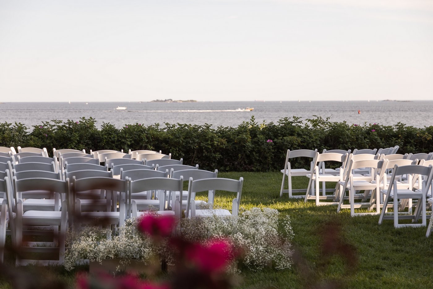 Outdoor wedding ceremony setup with ocean backdrop at Misselwood Estate in Beverly MA