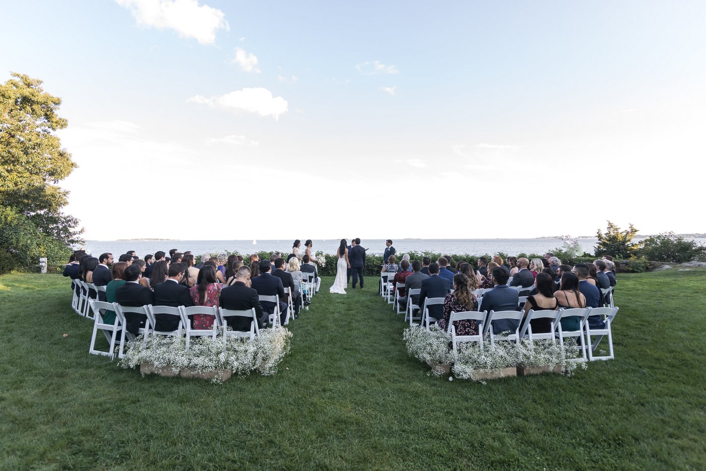 Outdoor wedding ceremony setup with ocean backdrop at Misselwood Estate in Beverly MA