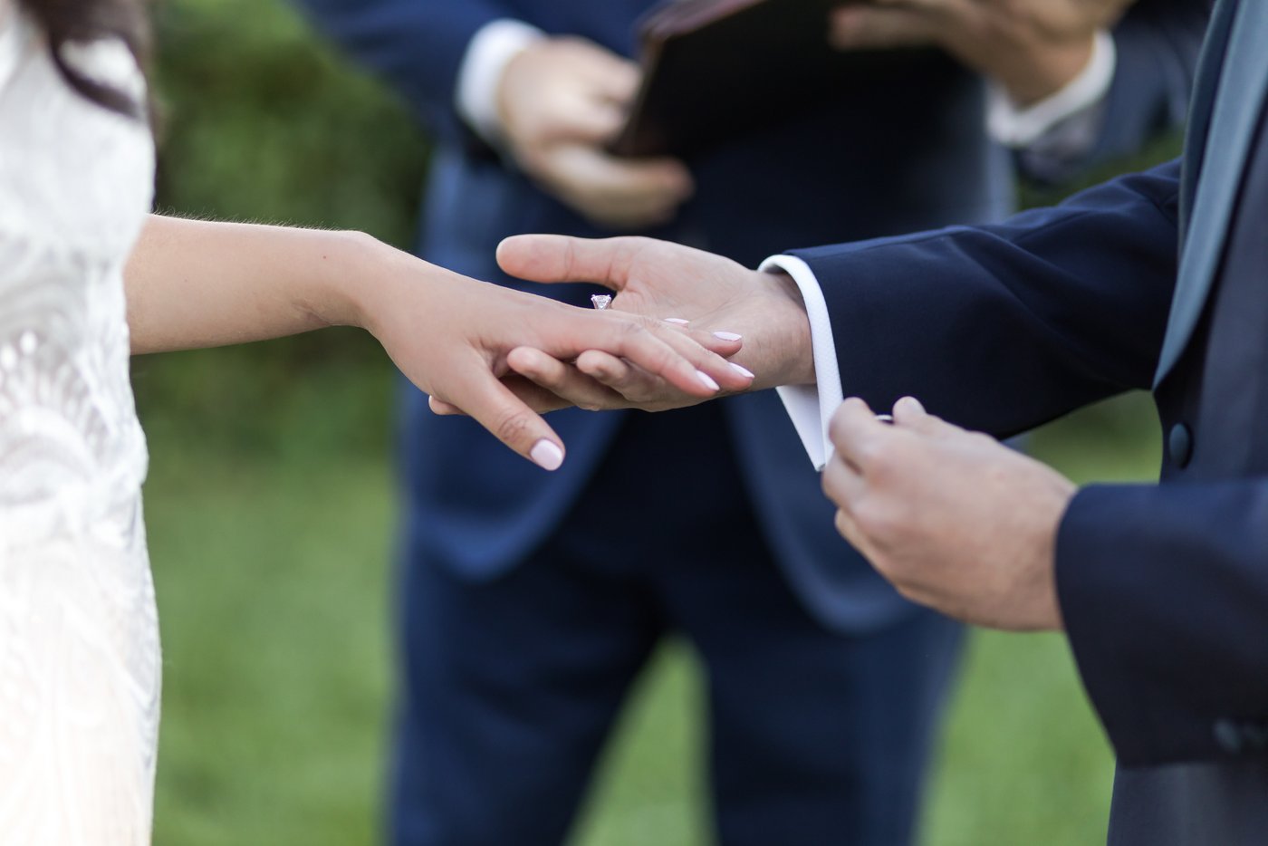 Ring exchange at outdoor wedding ceremony at Misselwood Estate in Beverly MA