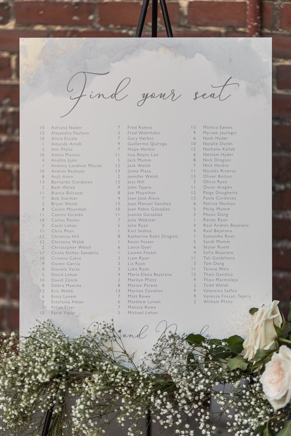 Elegant table chart at tented Misselwood Estate wedding