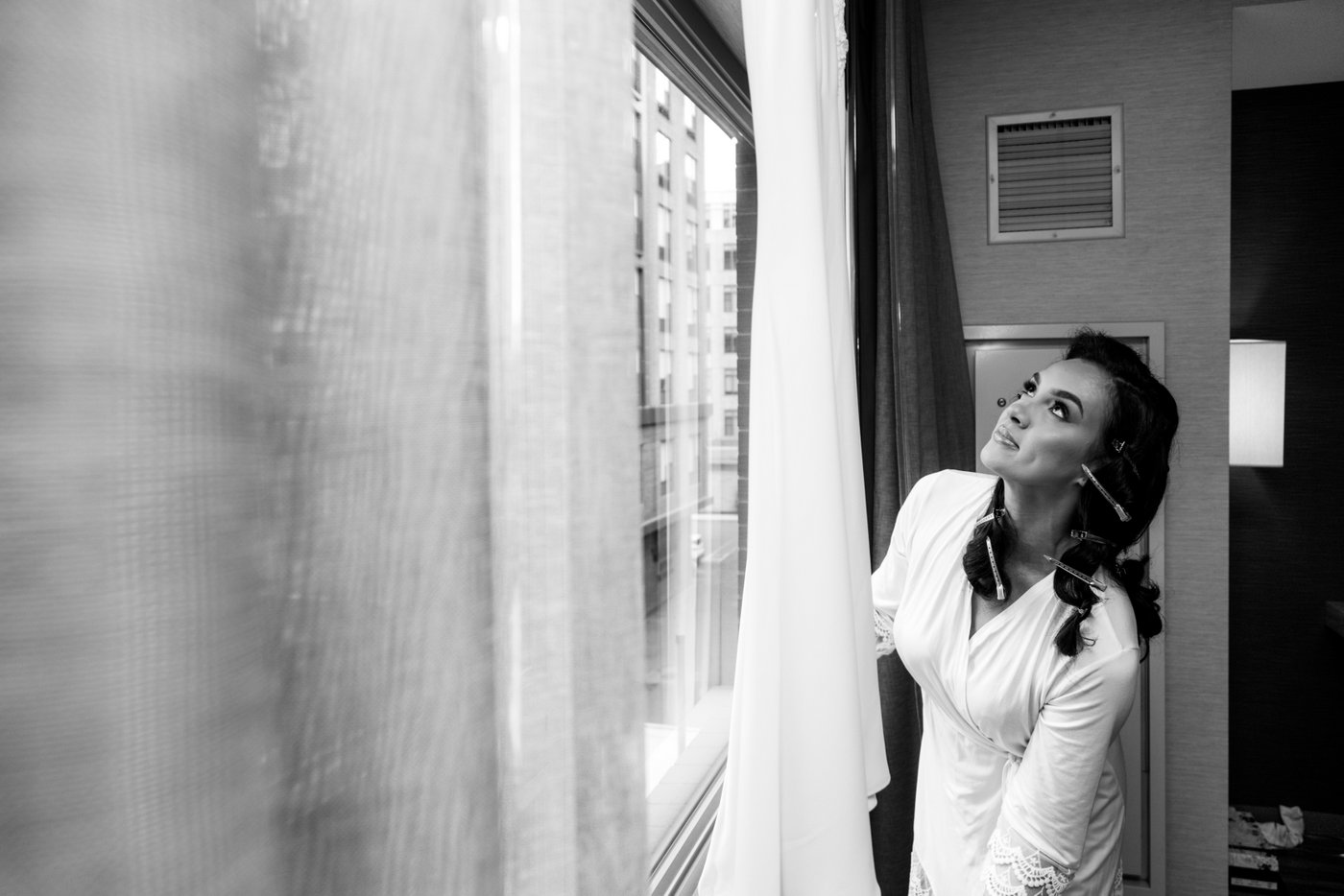 The bride admiring her wedding dress that she is about to wear for her Oceanview of Nahant wedding