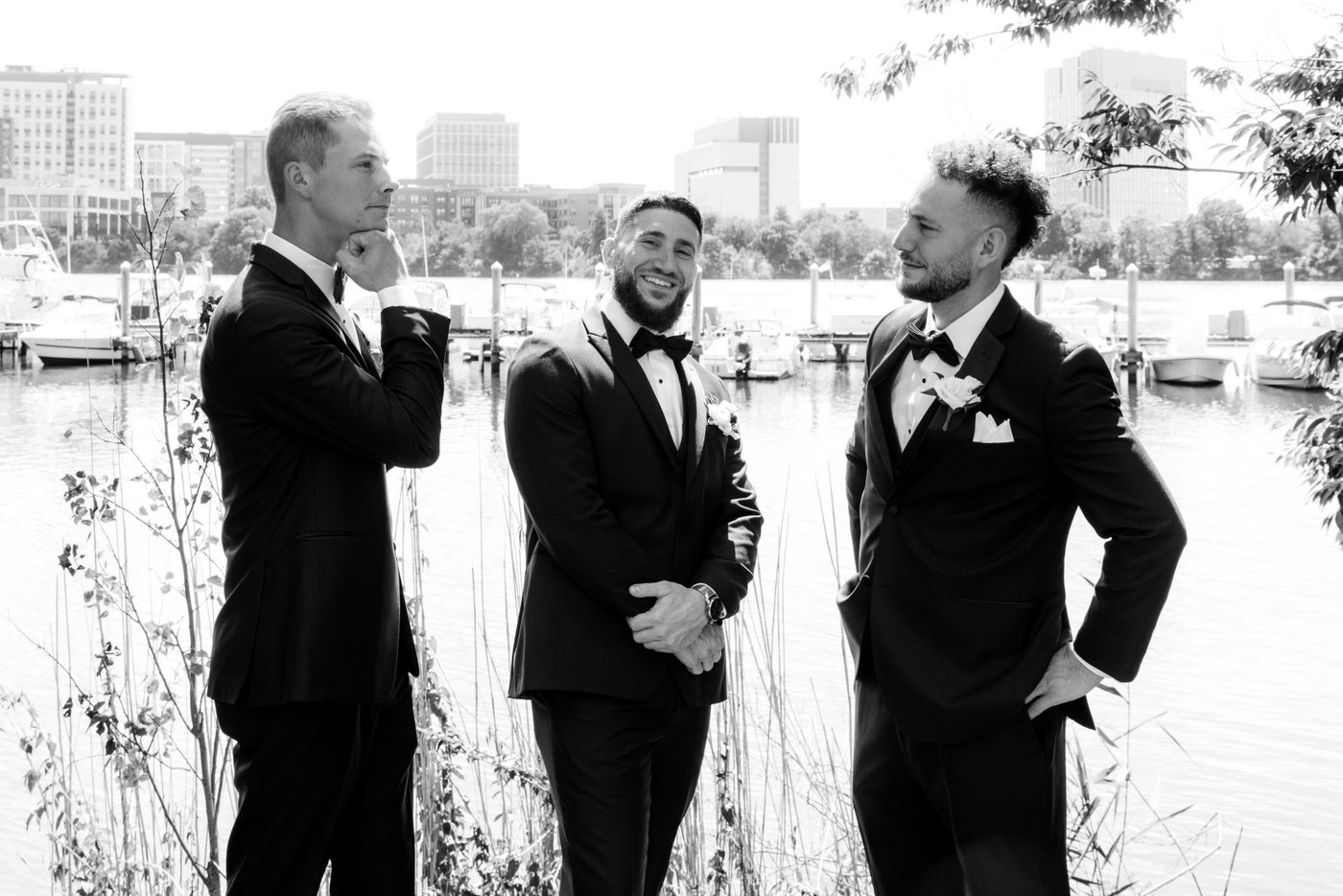 A goofy shot of the groom and his groomsmen by the Mystic River