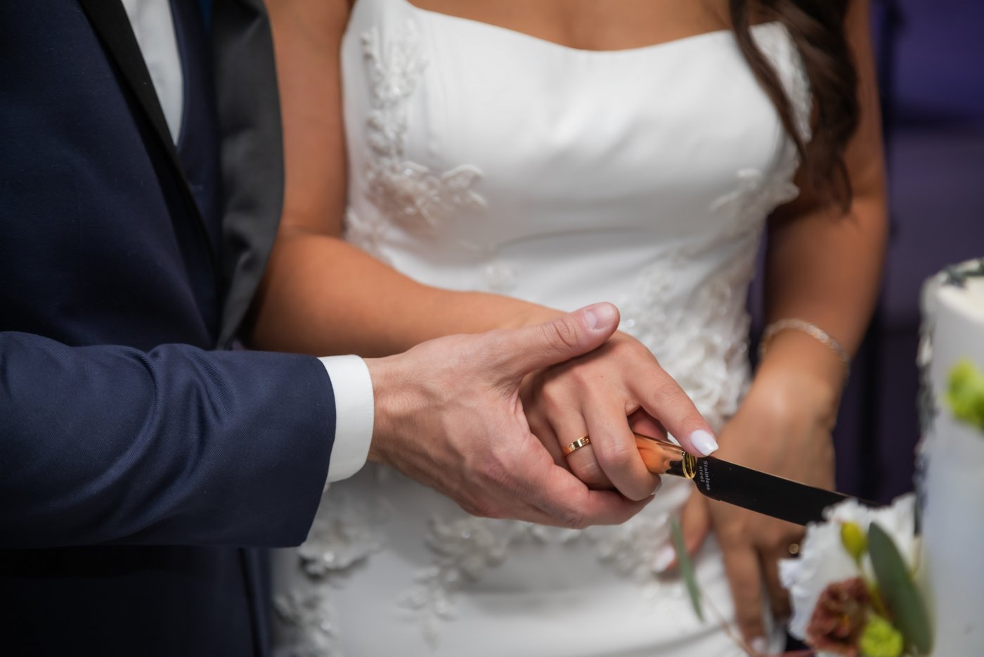 A close-up of the cake cutting