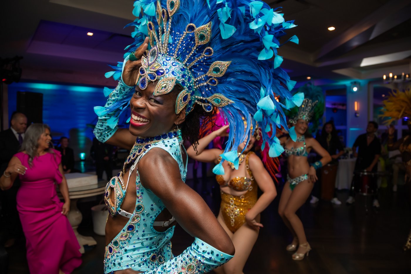 Brazilian samba dancers perform during a vibrant wedding reception at Oceanview of Nahant on the North Shore of Massachusetts.