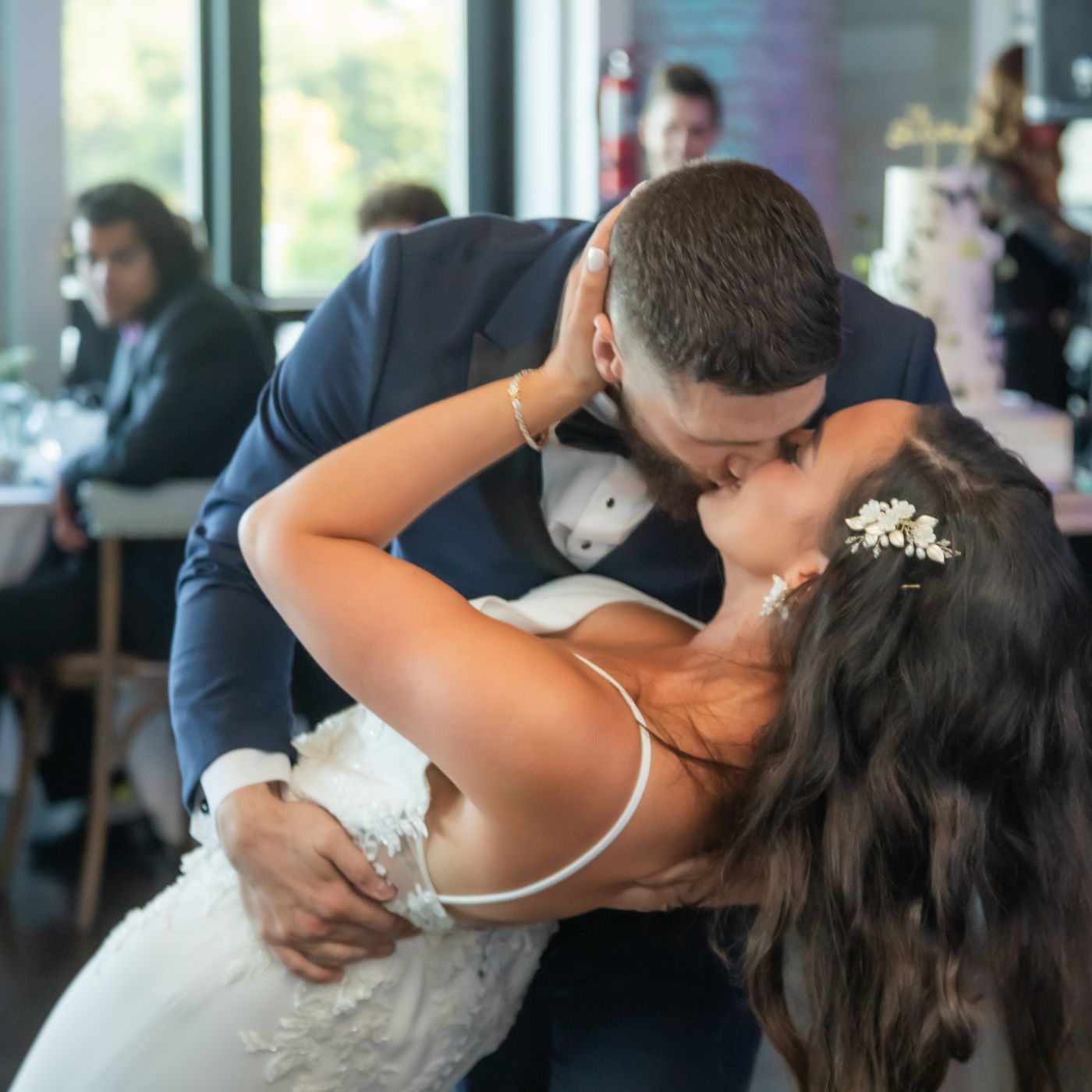 A close up shot of the groom dipping the bride during their first dance at their Oceanview of Nahant wedding reception.