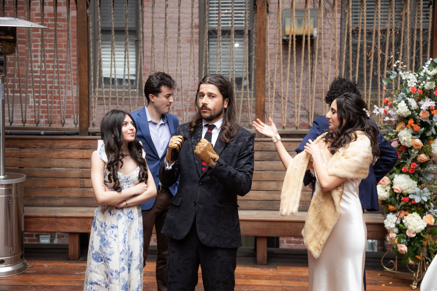 Wedding guests with bride on the patio at SRV Boston.