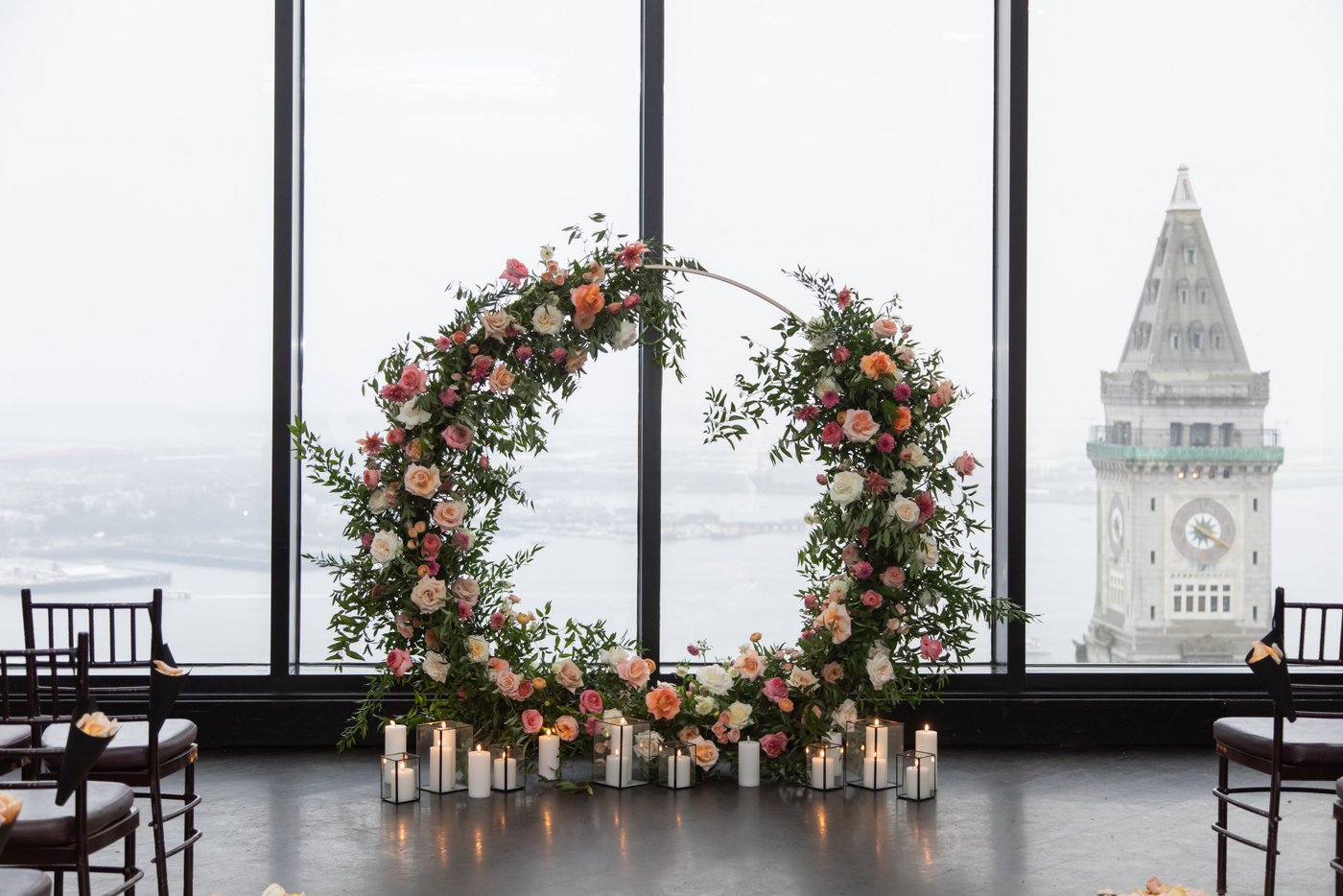 The State Room Boston wedding floral altar decorated with candles and roses