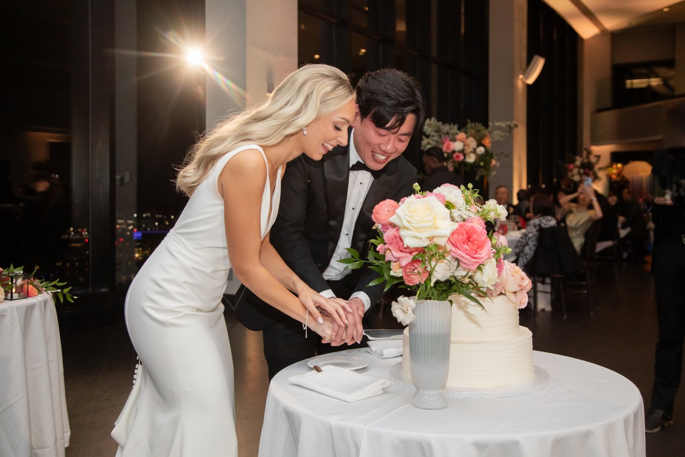 The bride and groom cut their wedding cake at the State Room