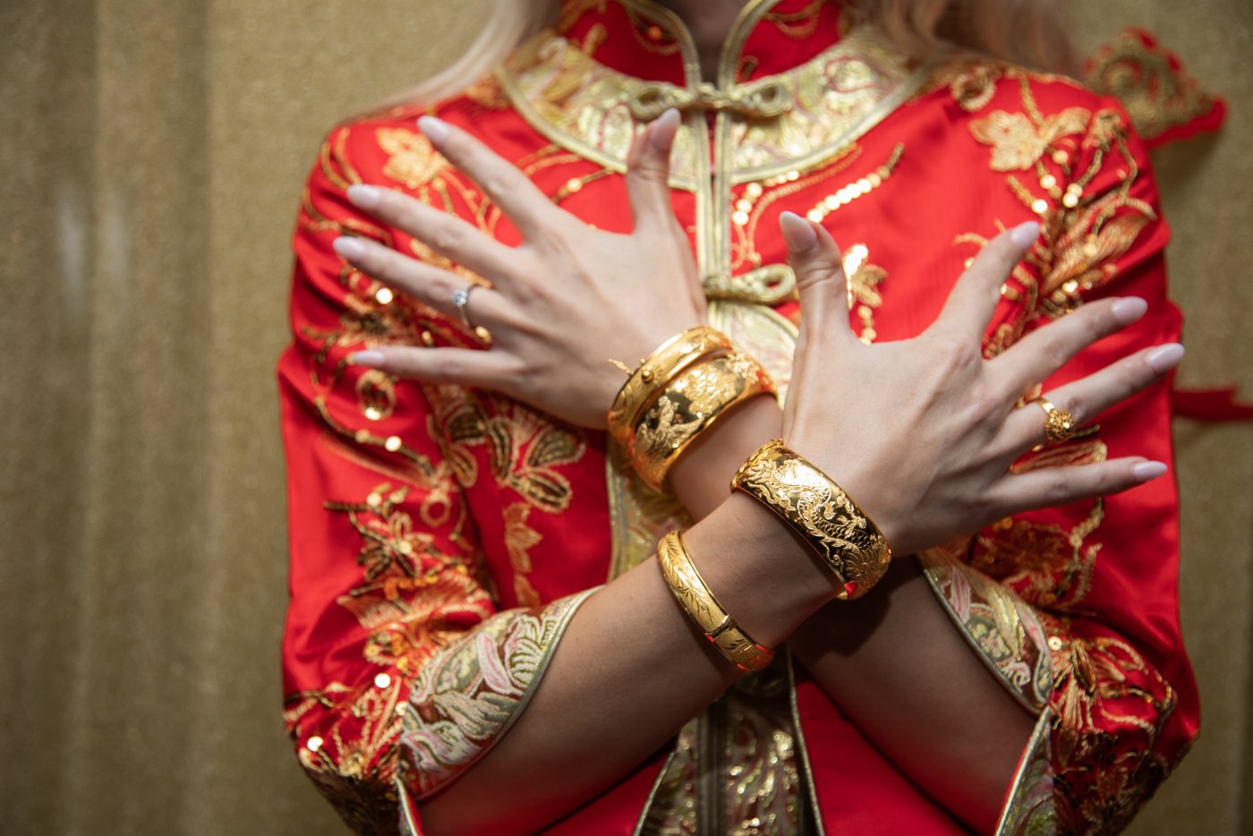 The bride's hands showcasing the jewelry she was gifted during the wedding tea ceremony at State Room Boston.