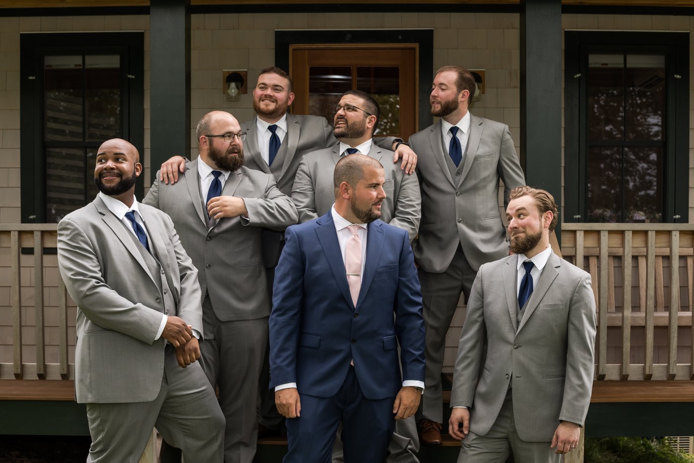 A goofy photo of the groom and his groomsmen at a Massachusetts barn wedding