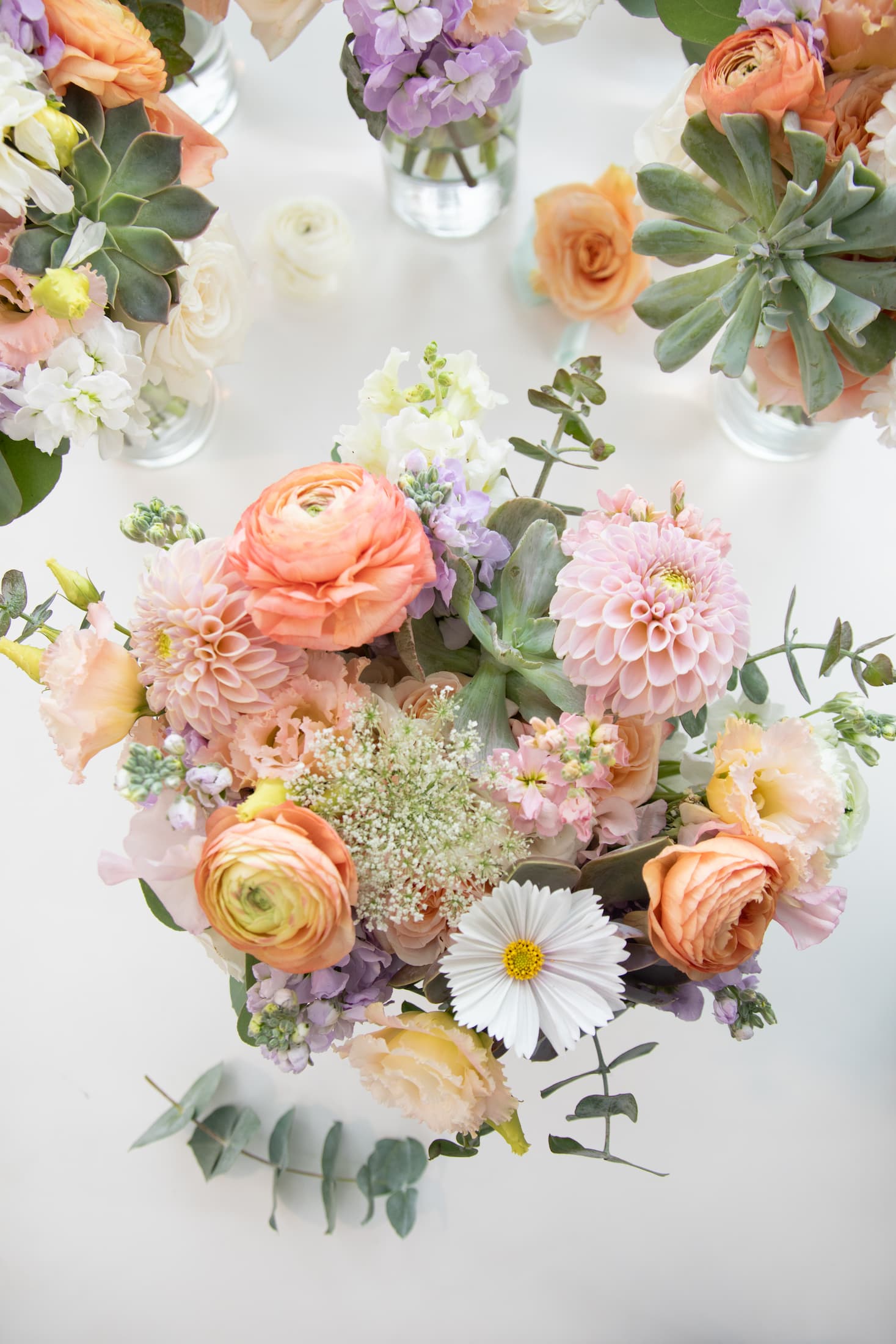 Stunning bouquets of pastel flowers for a dreamy Wychmere Beach Club wedding are shot against a white background by creative and candid Boston wedding photographers Spagnolo Photography who cover weddings throughout Massachusetts, including Cape Cod.
