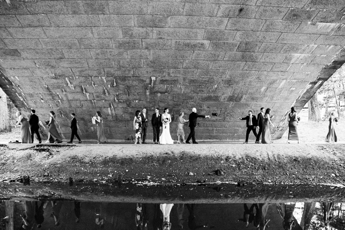 A black and white bridal party portrait at the Riverway Park in Brookline during a fall wedding in Brookline.