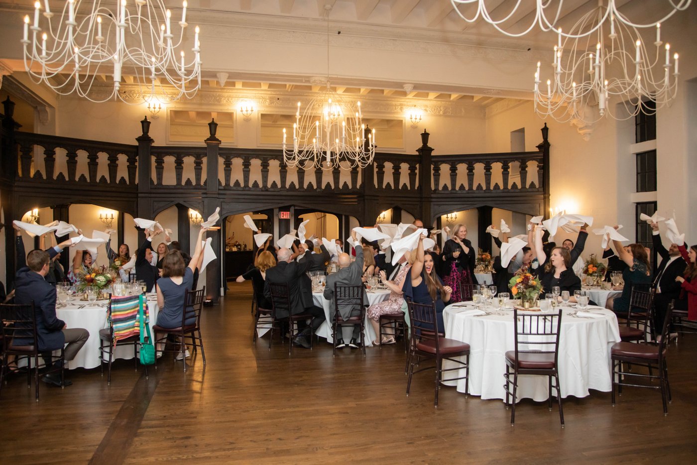 Guests wave their napkins for Grand Entrance at fall wedding in Brookline MA