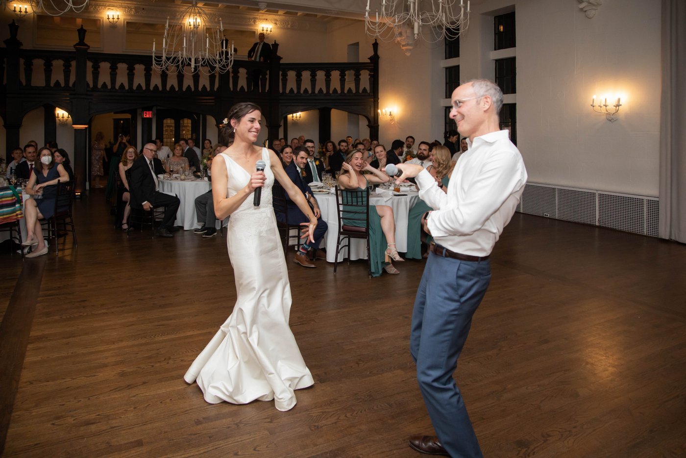 Bride and her father performing a song at fall wedding in Brookline MA