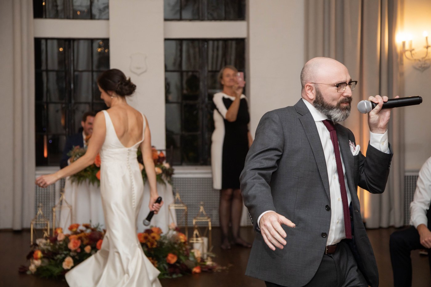 A relative joins the musical performance at the wedding in Brookline MA