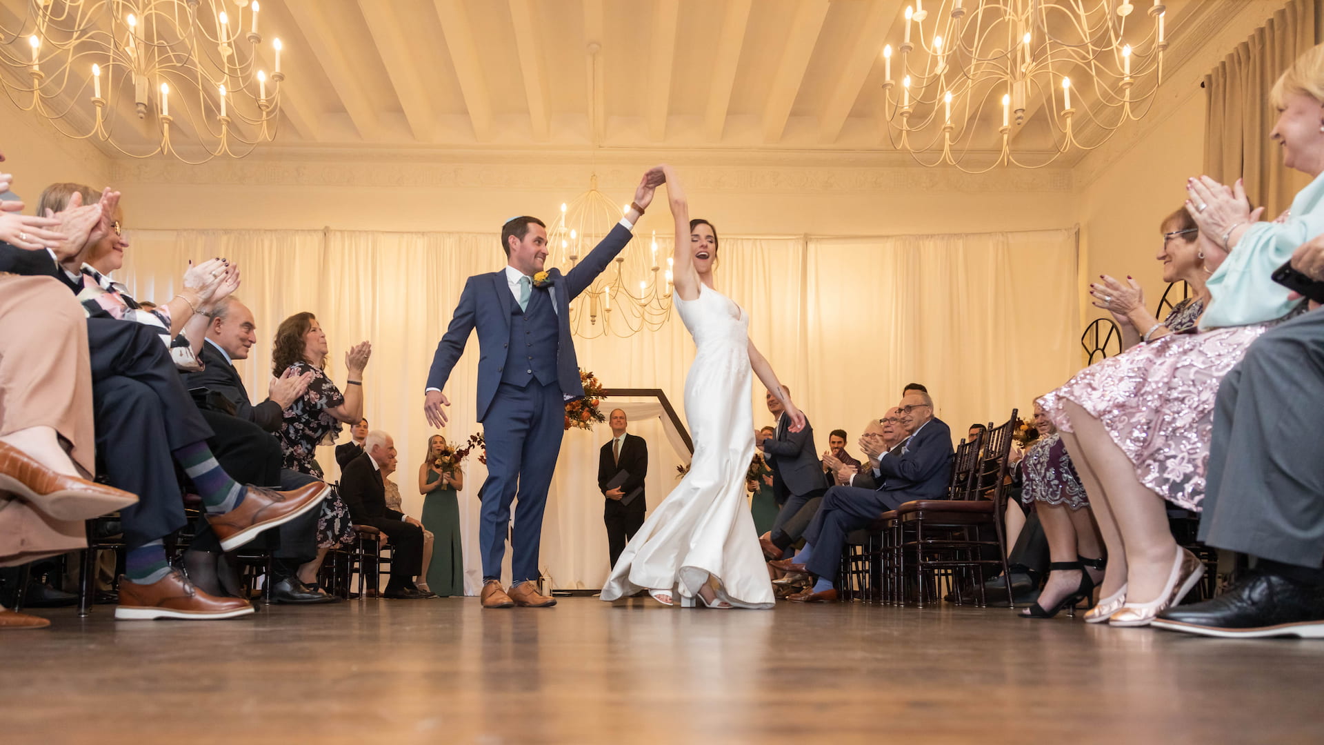 An epic exit for the newlyweds at a fall Jewish wedding at Alden Castle in Brookline MA, photographed by Boston wedding photographers Spagnolo Photography