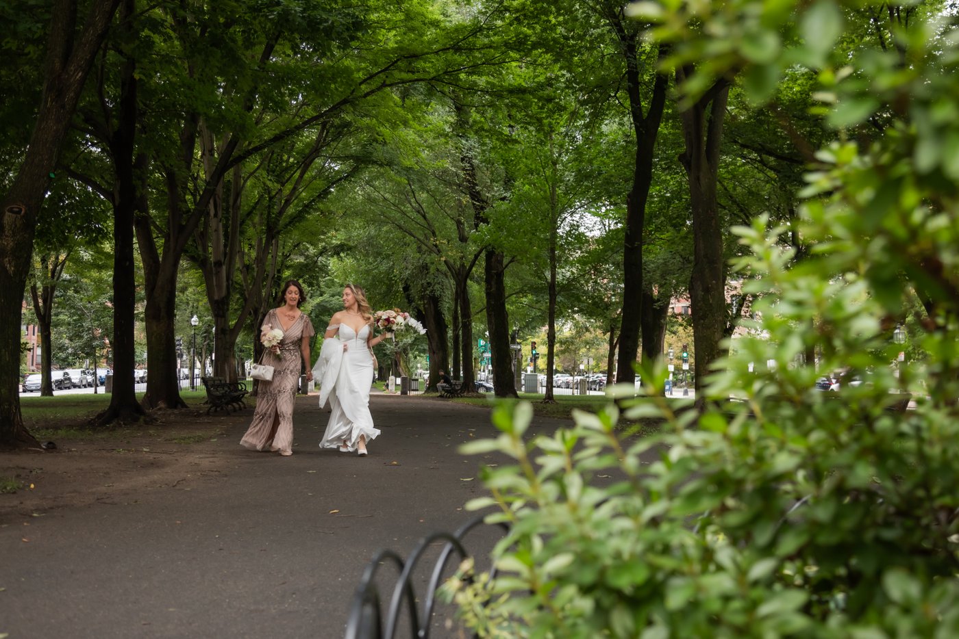 The bride and her mother walking through the Boston Public Garden, on their way to Terra at Eataly for the wedding