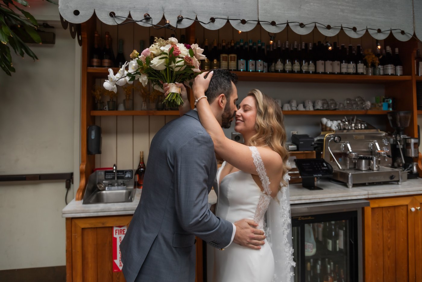 The bride and groom holding each other during a private moment after the wedding ceremony at Terra Boston