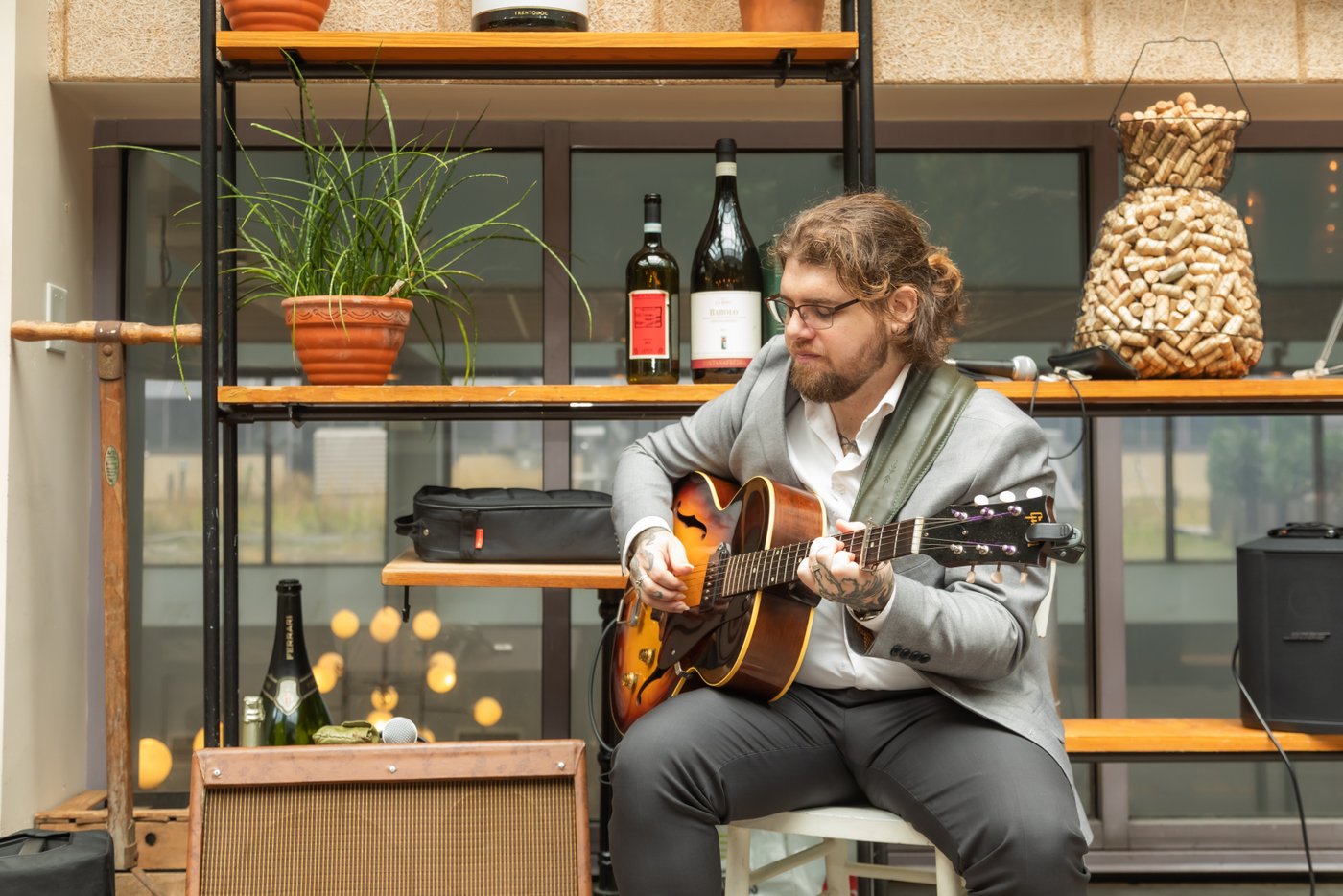 A guitarist playing live music at a wedding at Terra restaurant in Eataly in Boston.