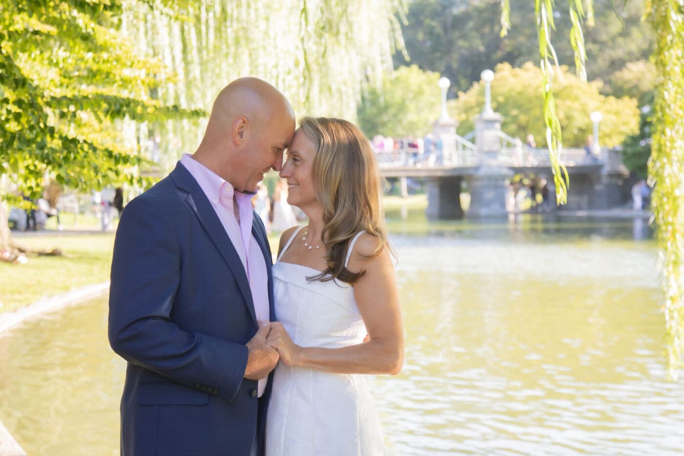 A couple leans their foreheads together and smile moments after their Boston Public Garden elopement, photographed by Boston elopement photographers Spagnolo Photography