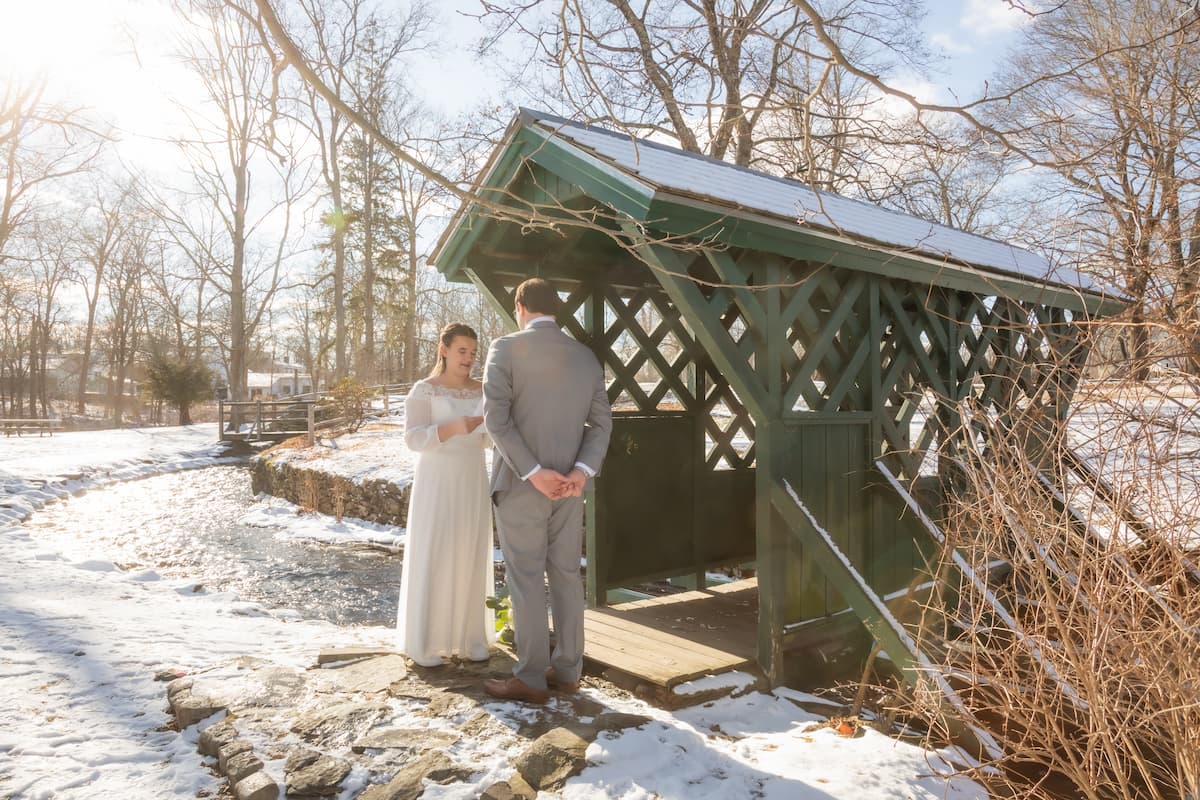 A first look in a snowy park during a winter wedding in Massachusetts