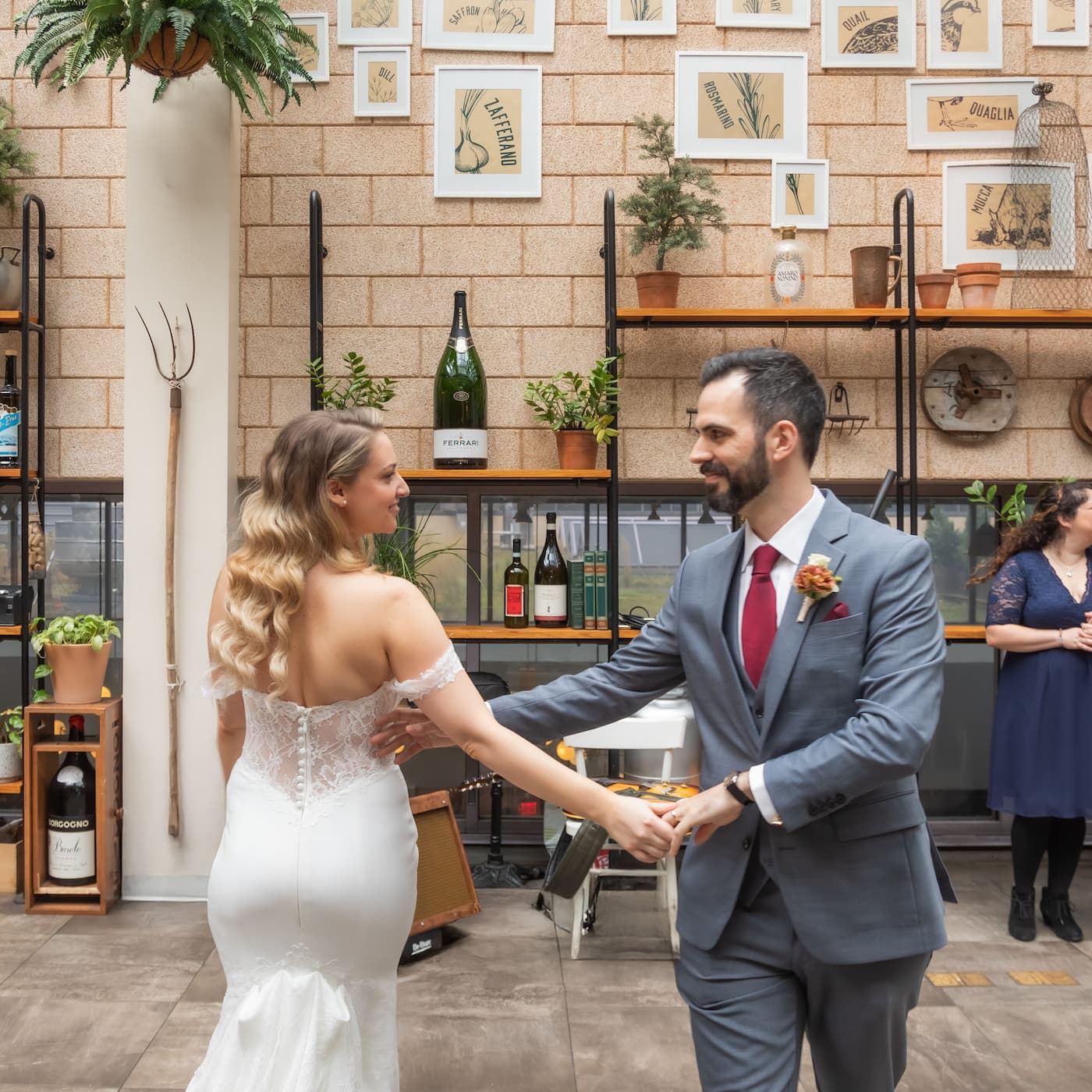 A bride and groom dance during their micro wedding reception at Terra at Eataly in Boston