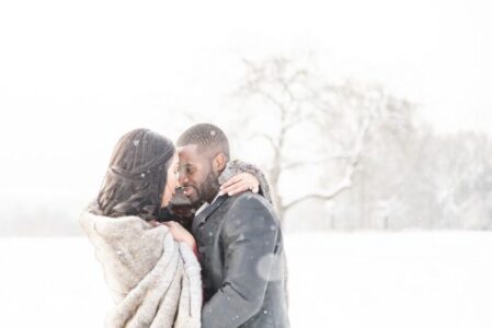 Daksha & Max's Cozy, Snowy Engagement at Ward Hill Reservation | North Shore An engagement gallery featuring a couple with snowfall, a cozy blanket, and a snow covered Ward Hill Reservation - Winter Engagement Photography in Massachusetts Gallery