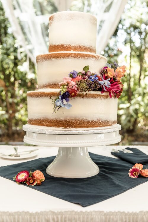 A naked spring wedding cake with fresh flowers at the Publick House in Sturbridge, MA
