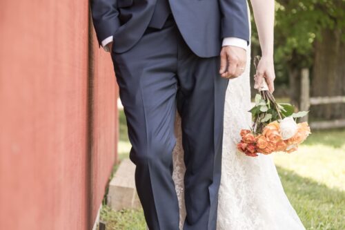 a close-up shot of a bride's bouquet as she's holding it pointed toward the floor at her micro-wedding in Massachusetts